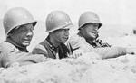 Brigadier General Theodore Roosevelt, Jr., Major General Terry Allen, and Lieutenant General George Patton observing the field near El Guettar, Tunisia, late Mar 1943