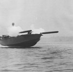 Elco 80-foot motor torpedo boat simultaneously launching two practice torpedoes during a training exercise in United States waters, 1942-44.