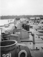 PT-221 and PT-222, Higgins 78-foot motor torpedo boats, along with many other PT Boats being stripped of their parts before their hulls were burned, Samar, Philippines, Nov 1945.