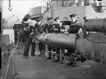 Sailors aboard the Norwegian destroyer HNoMS Stord reloading the ship’s torpedo tubes at Rosyth, Scotland, United Kingdom, Jan 1944.