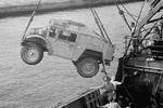 Canadian-built CMP Field Artillery Tractor being unloaded from a troop ship in Colombo harbor, Ceylon (now Sri Lanka), Feb 1942.