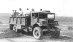Workers employing a Canadian-built Chevrolet CMP 3-ton truck for post-war maintenance at the Iwakuni Airstrip, Iwakuni, Japan, late 1940s.