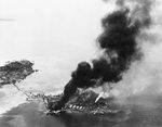 Japanese facilities afire, Tanambogo Island, east of Tulagi, Solomon Islands, 7 Aug 1942