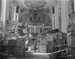 US 3rd Army soldier guarding loot found stored in the Schlosskirche (Castle Church) at the Ellingen Castle in southern Germany, 24 Apr 1945