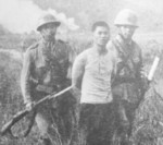 Japanese troops escorting a captured Chinese spy, Jiangsu Province, China, 1938