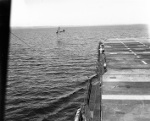 US Navy TDN-1 drone test from the decks of the training carrier USS Sable while steaming in reverse in Grand Traverse Bay, Michigan, United States, 10 Aug 1943. This particular test was unsuccessful. Photo 4 of 4.