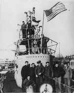 Crew members of the submarine USS Sailfish gather on the after deck in Groton, Connecticut, United States in Sep 1945 still celebrating the news that Japan had surrendered.