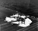 Ensign Ardon R. Ives of Fighting-Bombing Squadron VBF-9 crashed his F6F-5 Hellcat through the barrier on USS Lexington (Essex-class) and ruptured the center-line fuel tank, Feb 1945, western Pacific. Photo 2 of 7