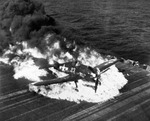 Ensign Ardon R. Ives of Fighting-Bombing Squadron VBF-9 crashed his F6F-5 Hellcat through the barrier on USS Lexington (Essex-class) and ruptured the center-line fuel tank, Feb 1945, western Pacific. Photo 3 of 7