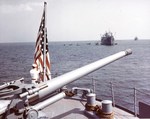 Tending to the colors aboard a troop transport ship during exercises off the east coast of the United States, mid-1942.