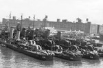 Destroyers line the dock at Norfolk Naval Operating Base, Norfolk, Virginia, United States, May 1943. Visible are USS Edison, USS Schroeder, USS Spence, and USS Foote.