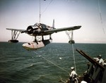 Vought OS2U Kingfisher floatplane being hoisted aboard the battleship USS Missouri during her Atlantic shakedown cruise, Aug 1944.