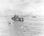Cruiser USS Nashville, General Douglas MacArthur’s flagship during the Leyte Gulf operations, at anchor off Leyte, Philippine Islands, about 21 Oct 1944. Note destroyer USS Bush at right.