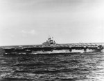 Carrier USS Bunker Hill on station for strikes against Kyushu, Japan, 18 Mar 1945. Photo was taken from the carrier USS Essex and the battleship USS New Jersey is seen in the right background.
