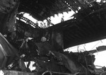 USS Randolph with heavy damage to the hangar deck and flight deck after a P1Y Ginga special attack bomber crashing into the ship while at anchor in Ulithi Lagoon, Caroline Islands, 11 Mar 1945.