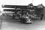 President Roosevelt (blocked from view seated in the rear seat of the lead car) tours PB2Y Coronado production at the Consolidated Aircraft plant at Lindbergh Field, San Diego, California, United States, 25 Sep 1942.