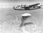 B-24G Liberator “Fertile Myrtle” with the 724th Bomb Squadron flying over the burning oil refinery at Almásfüzitő, Hungary on the banks of the Danube, 9 Aug 1944.