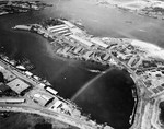 Aerial view of the Pearl Harbor Submarine Base with the supply depot on the Kuahua Peninsula in upper center, 13 Oct 1941. Note the building in the lower left with a roof painted to resemble two smaller buildings.