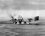 Battleship USS Mississippi bombarding Luzon, Philippines, 8 Jan 1945, during the Lingayen Gulf operation. Battleship USS West Virginia and cruiser HMAS Shropshire are behind Mississippi.