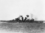 HMS Exeter firing on Japanese aircraft, Gaspar Strait, 15 Feb 1942; photograph taken from HMAS Hobart