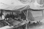 Man of 613th Field Artillery Battalion, US 5332nd Brigade (Provisional) resting, Burma, 1945; the 