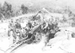 Members of US 5332nd Brigade (Provisional) with a 75mm howitzer, Burma, 1945; Hudinski, Kandrac, Beal, Hedder, Horton, Barksdale, King, Fulton, and Winters