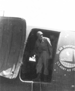 Member of US 5332nd Brigade (Provisional) George Beal entering a C-47 aircraft bound for China, Lashio Airport, Shan, Burma, Apr 1945