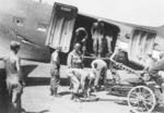 Loading equipment onto a C-47 aircraft, Lashio Airfield, Shan, Burma, Apr 1945; photo taken by personnel of US 5332nd Brigade (Provisional)