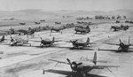 Airplanes on the ramp at Naval Air Station Livermore, California, United States, 1944-45. Note F4F (or FM2) Wildcats, SB2C Helldivers, and TBM Avengers.