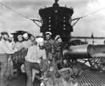 Chief Torpedoman Harold Stromsoe (far left) and others at the deck gun of USS S-44, Jan 1943