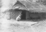 Civilian and home, Burma, 1945; photo taken by a members of US 5332nd Brigade (Provisional)