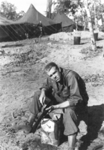 Clyde Covault of US 5332nd Brigade (Provisional) cleaning his Thompson submachine gun, Camp Landis, Kachin, northern Burma, Dec 1944