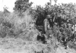 Sergeant Cole, Lieutenant Sittner, and Corporal Pierce of US 5332nd Brigade (Provisional) at the airstrip at Camp Landis, Kachin, northern Burma, Dec 1944, photo 1 of 2