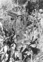 Sergeant Cole, Lieutenant Sittner, and Corporal Pierce of US 5332nd Brigade (Provisional) at the airstrip at Camp Landis, Kachin, northern Burma, Dec 1944, photo 2 of 2