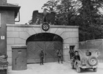 American soldiers guarding the entrance to Dachau Concentration Camp, Germany, late Apr or early May 1945