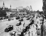 Juma Masjid mosque, Chungwah restaurant, and a mix of US military and Indian civilian vehicles, Central Avenue, Calcutta, India, 1945