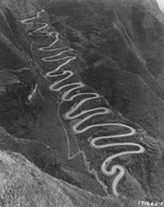 The 24-Turns section of the Kunming-Chungking (Chongqing) Road in China climbs 650 vertical feet using 1.8 miles of road to cover one-quarter of that distance laterally, Guizhou Province, China, 1944, photo 2 of 2