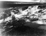 Strike photo taken from an SB2C Helldiver from Ticonderoga showing the vigorous attack on shipping in the Mekong River, Saigon, French Indochina (now Ho Chi Minh City, Vietnam), 12 Jan 1945.