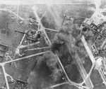 Strike photo taken from a Wasp (Essex-class) aircraft showing an attack on the Tan Son Nhut airfield near Saigon, French Indochina (now Ho Chi Minh City, Vietnam), 12 Jan 1945.