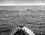 View from United States Coast Guard cutter Spencer as she approached U-175 after being forced to the surface by depth charges and just before U-175 sank, North Atlantic, 500 nautical miles WSW of Ireland, 17 Apr 1943.