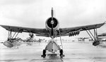OS2U Kingfisher scout plane with five Mousetrap anti-submarine rockets mounted under one wing for testing purposes, Banana River, Florida, United States, 11 Dec 1942. Photo 1 of 4.