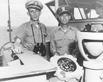 United States Navy Captain Daniel Gallery and Lt(jg) Albert David on the bridge of escort carrier USS Guadalcanal in the Atlantic following the capture of the German U-505, Jun 1944.