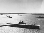 American aircraft carrier USS Wasp (Wasp-class) at anchor in Scapa Flow, Orkney Islands, Scotland, United Kingdom, 6 Apr 1942. Cruiser USS Wichita is seen at right and battleship USS Washington in the center.