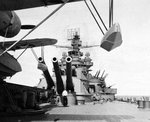 USS Pennsylvania’s #4 main battery seen from under the wing of an OS2U Kingfisher catapult scout plane as the battleship is preparing for the bombardment of Attu Island in the Aleutians, 11 May 1943.