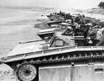 LVT Buffalos on a beach during a training exercise, Jun 1945. Note Browning M2 and M1919 machine guns.