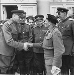 Soviet Marshal Konstantin Rokossovsky, left, greeting British Field Marshal Bernard Montgomery, right, during a visit to Rokossovsky’s headquarters in Wismar, Germany, 7 May 1945.