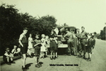 Curious German children surrounding US Army personnel with broken-down vehicle, western Germany, Jun 1945