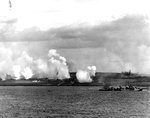 As seen from battleship USS Texas, Fletcher-class destroyer USS Twiggs engaging in a pre-invasion bombardment of Iwo Jima’s landing beach White 2 in support of underwater demolition team operations, 17 Feb 1945.