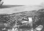 View of Tecklenborg shipyard, Bremerhaven, Germany, 1920s; note two merchant ships tied up in the equipping peir (middle right) and shipyard administration building (white building, bottom center)