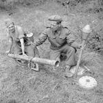 Demonstration of a captured German Panzerschreck weapon by an instructor of UK 59th Division, France, 1 Aug 1944